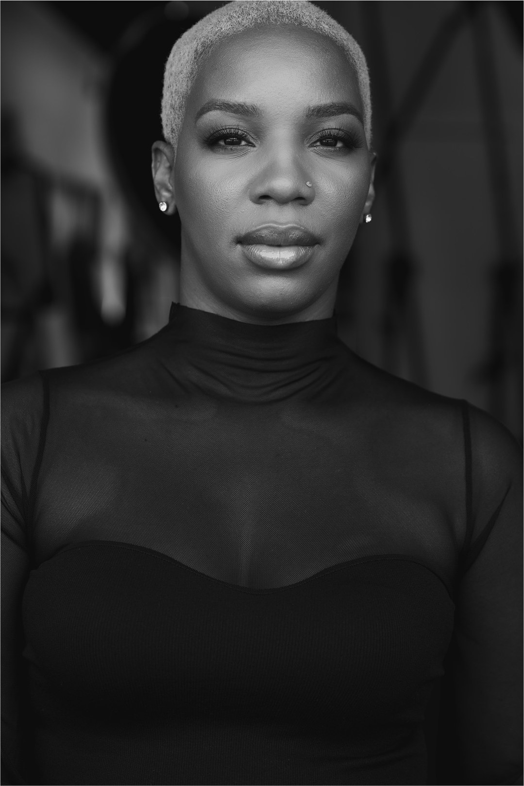 Black and white portrait of Courtney Nevins, founder of DÉRA Skin OS